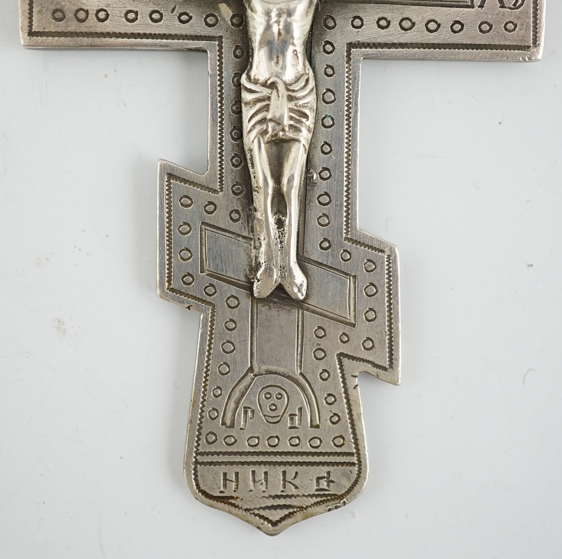 A late 19th century Russian 84 zolotnik silver crucifix, assay master Lev Oleks, Moscow, 1896, engraved with Cyrillic script